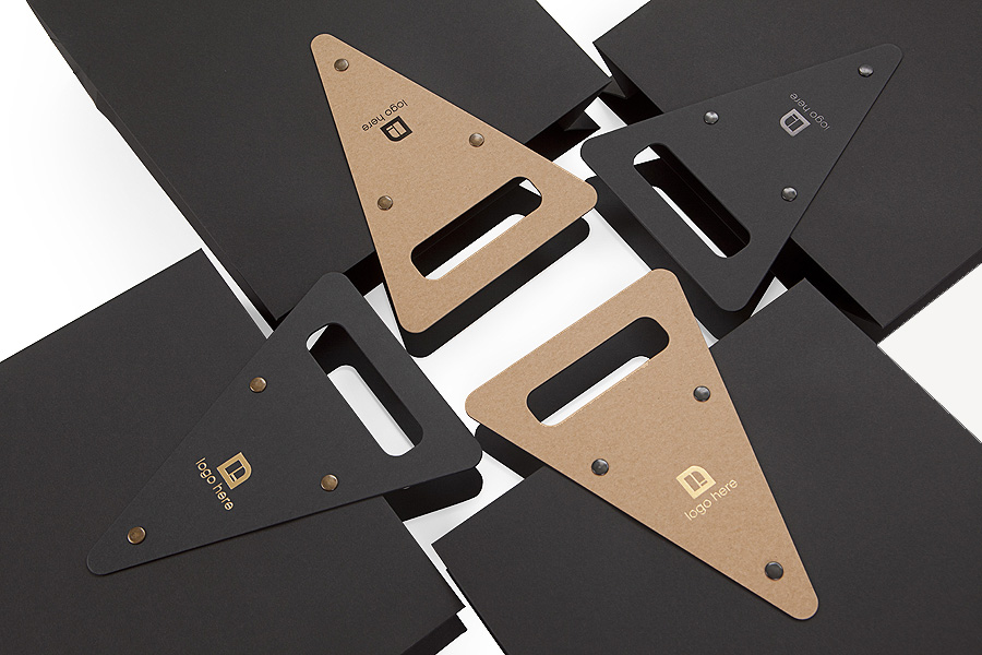 Exclusive gift bag with riveted die-cut handle, Koehler Brilliant Black and SH recycled paper, custom hot foiled branding, paper bag manufacturer from Europe