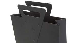 Koehler Brilliant Black paper and SH recycled brown paper riveted die-cut handle hot foiled logo