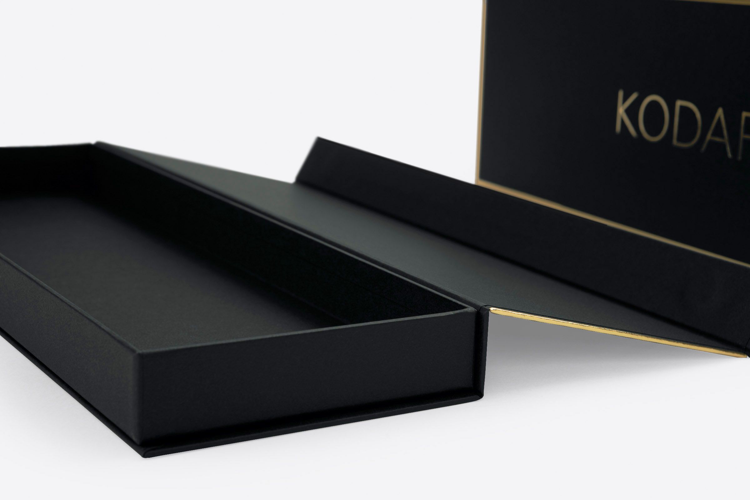 exclusive magnetic necktie boxes with gold foil stamping on black Colorplan Ebony paper with Morocco embossing